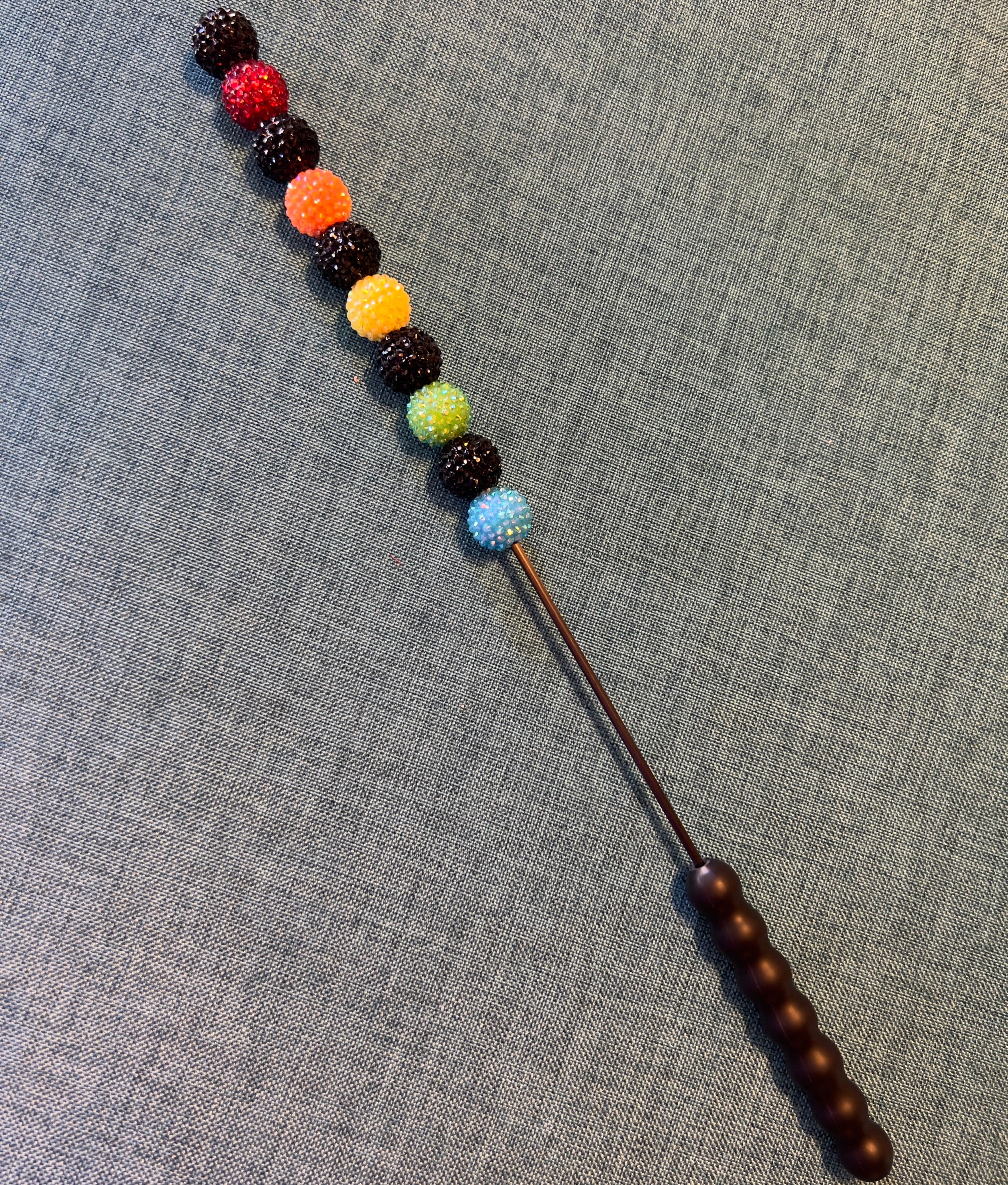 Black and rainbow jeweled beater bar