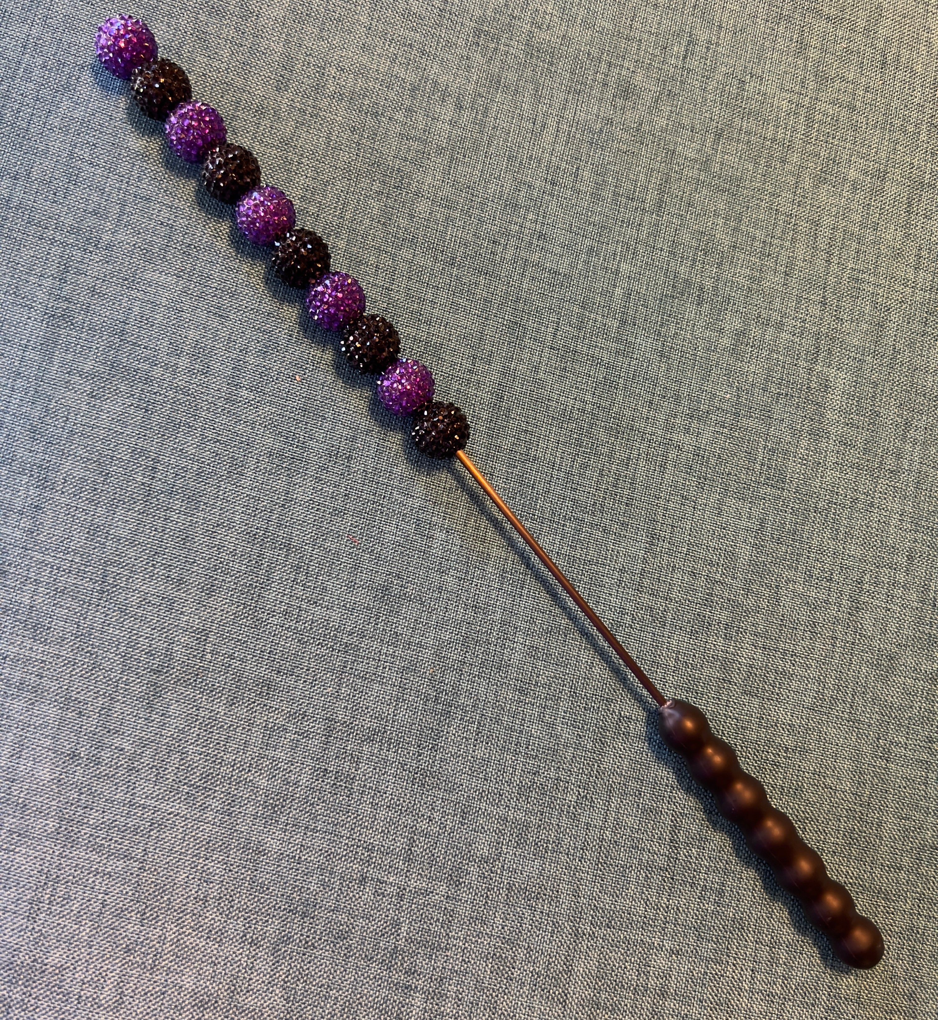 Purple and black jeweled beater bar