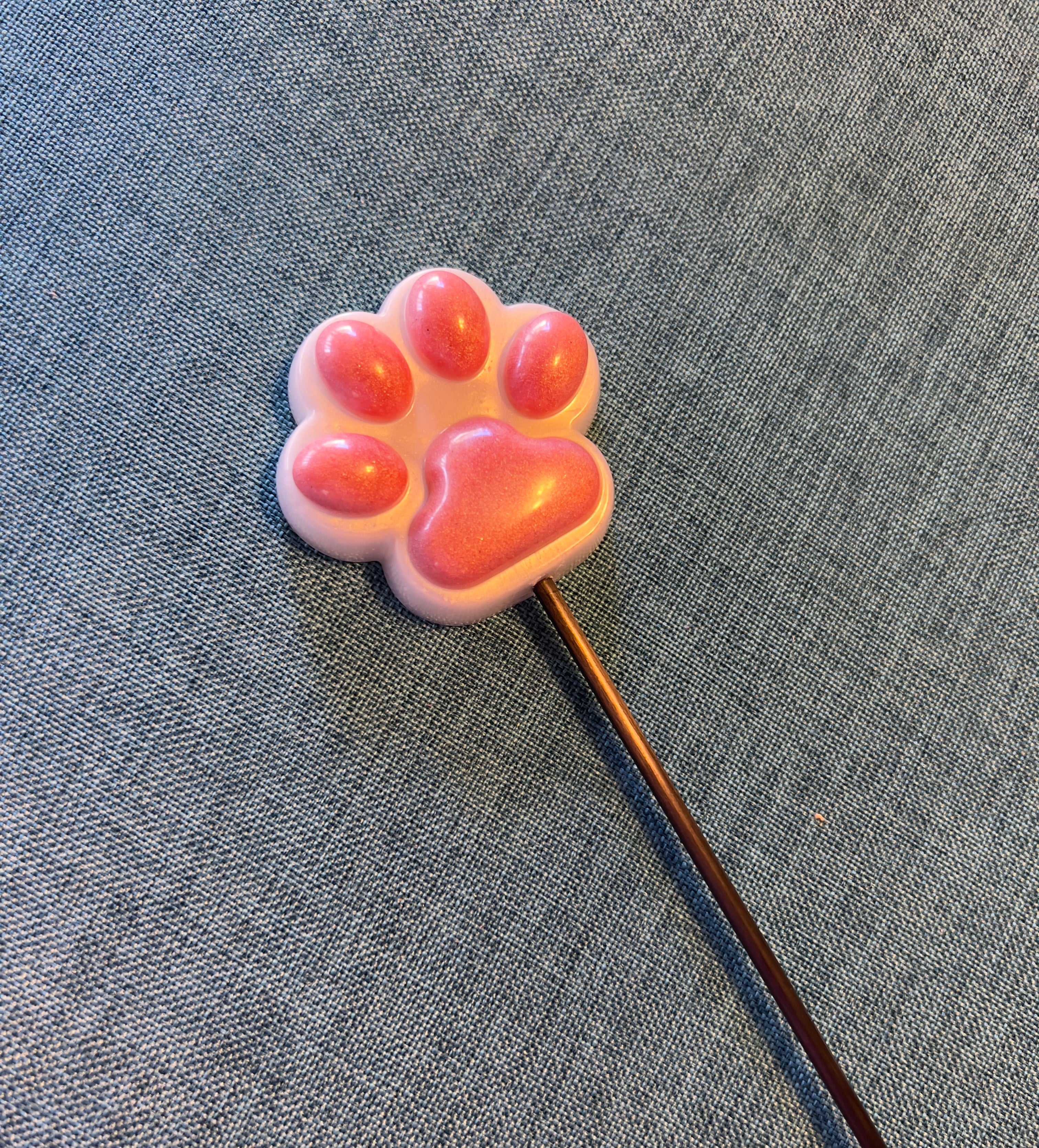 Pink and white paw